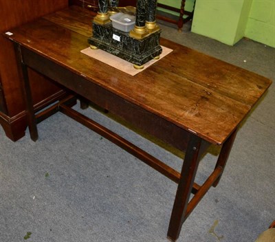 Lot 1371 - An oak side table, with two plank top on H form stretcher