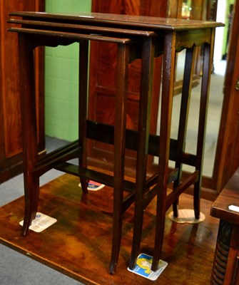 Lot 1398 - Nest of three mahogany inlaid tables