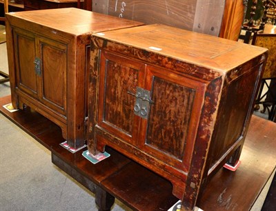 Lot 1402 - A pair of Chinese hardwood bedside cabinets