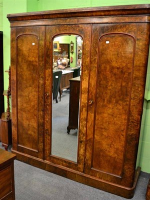 Lot 1409 - Victorian walnut veneered triple wardrobe, one door with glazed panel