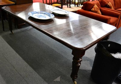 Lot 1416 - A late Victorian oak wind out dining table