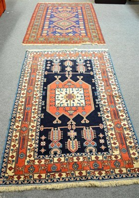 Lot 1424 - Erivan rug, South Caucasus, the navy field of stepped medallions enclosed by rosette borders,...