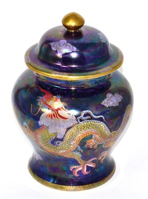 Lot 4 - A Maling lustre baluster vase and cover, decorated with a trailing dragon