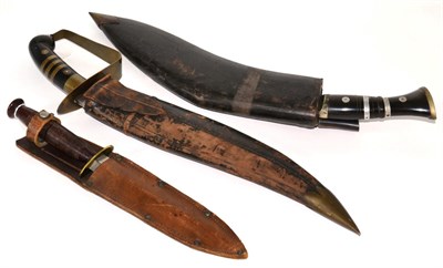 Lot 6 - A Sheffield-made, Fairbairn Sykes-type fighting knife, with turned wood grip, leather sheath;...