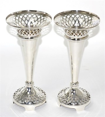 Lot 19 - A pair of silver trumpet shaped vases with pierced rims and bases