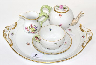 Lot 21 - A Herend porcelain twin handled tray, teapot, tea cup and saucer and cream jug