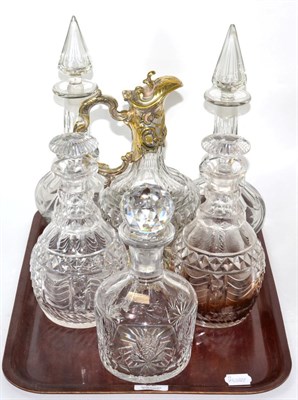 Lot 22 - Two pairs of cut glass decanters, a single decanter and a silver plate mounted claret jug