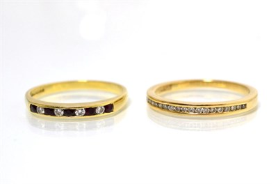 Lot 60 - An 18 carat gold diamond half hoop ring, channel set with round brilliant cut diamonds, stated...