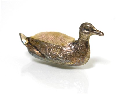 Lot 64 - A miniature silver pin cushion, as a duck