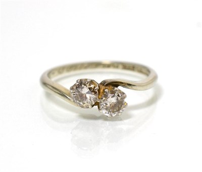 Lot 69 - A diamond crossover ring, two old cut diamonds in claw settings, to bypass scroll shoulders,...