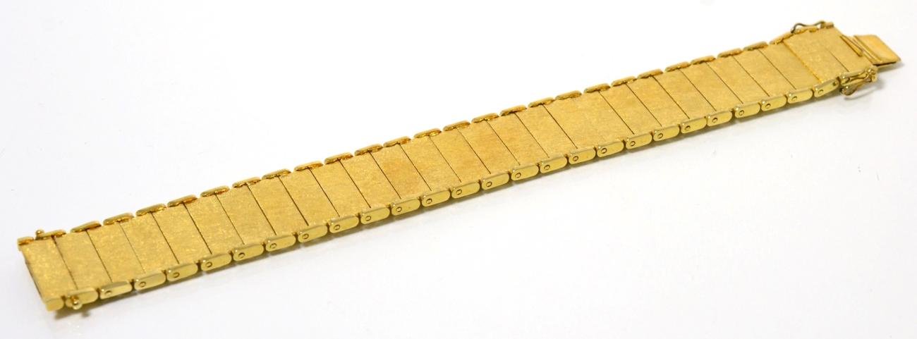 Lot 77 - A 9 carat gold bracelet, of brushed polished rectangular bar links, length 18cm, width 2cm,...