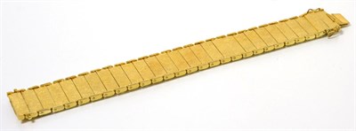 Lot 77 - A 9 carat gold bracelet, of brushed polished rectangular bar links, length 18cm, width 2cm,...