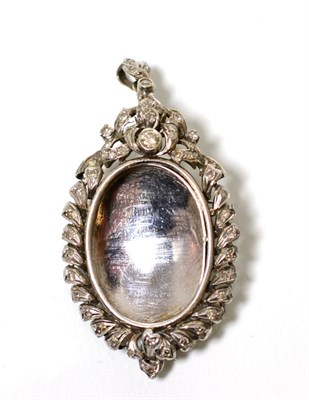 Lot 96 - A diamond locket pendant/brooch, an oval frame set throughout with eight-cut and round...