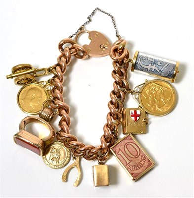 Lot 103 - A curb link charm bracelet, with a loose mounted George V 1912 sovereign; a loose mounted...