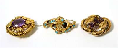 Lot 110 - A Victorian turquoise brooch, of chased interlocked scrolls, set with turquoise, measures 2.5cm...