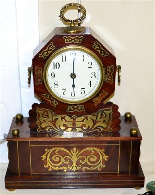 Lot 128 - A brass inlaid mantel clock