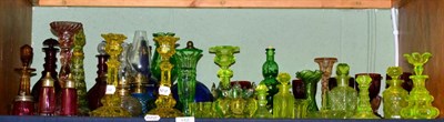 Lot 156 - A quantity of 19th century coloured glass including uranium glass vases and bottles