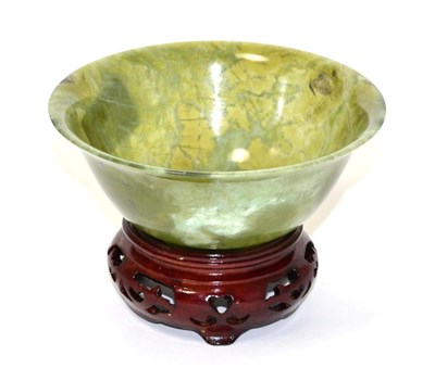 Lot 167 - A Chinese spinach jade bowl, 20th century, 12.5 diameter, on wooden stand