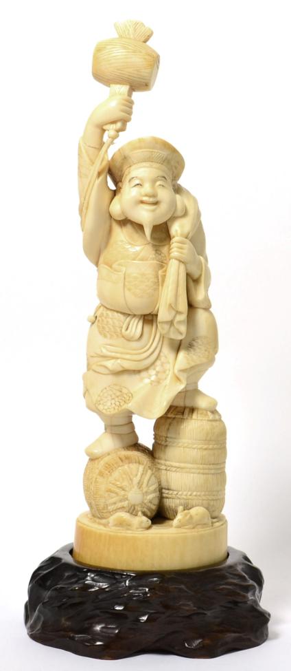 Lot 172 - A Meiji period ivory okimono of a laughing Buddha with hammer signed Xue Ming