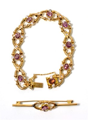Lot 203 - A garnet and white stone bracelet and brooch suite, oval cut pink garnets in rubbed over...