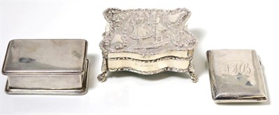 Lot 227 - A Victorian silver jewellery box on paw feet, decorated in repousse with a courting couple, a...
