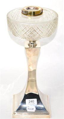 Lot 240 - A silver based oil lamp with clear glass reservoir (weighted)