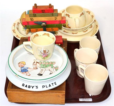Lot 243 - A group of Royal Doulton Bunnykins wares; Shelly Mabel Lucie Atwell baby plate; wooden toys,...