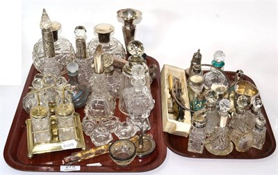 Lot 275 - A collection of silver collared and topped scent bottles, silver cream jug, silver photograph...