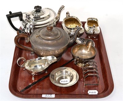 Lot 279 - Two silver teapots; a silver cream and sugar; two silver sauce boats; a silver toast rack;...