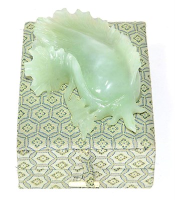 Lot 307 - A Chinese carved jade cabbage leaf, 16cm long