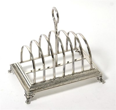 Lot 308 - A Victorian silver toast rack, Henry Wilkinson & Co, Sheffield 1872, rectangular with hooped...