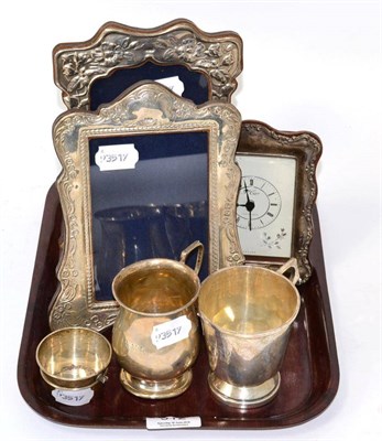 Lot 312 - Two silver photograph frames, modern silver framed mantel timepiece, two silver Christening...