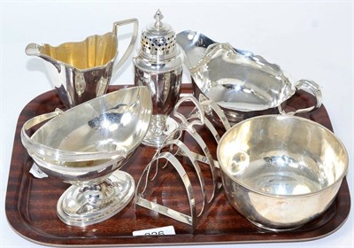 Lot 326 - A group of silver comprising  a sauce boat, a bowl, castor, a four division toast rack, a...