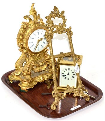 Lot 327 - A gilt metal mantle timepiece, a brass carriage timepiece and a brass easel stand