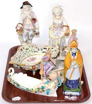 Lot 330 - A French porcelain floral painted basket, two Continental figures, a Quimperware model of a Bishop