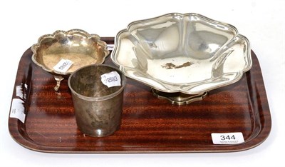 Lot 344 - A silver pedestal dish, Sheffield 1912; a small silver dish; and a French silver beaker,...