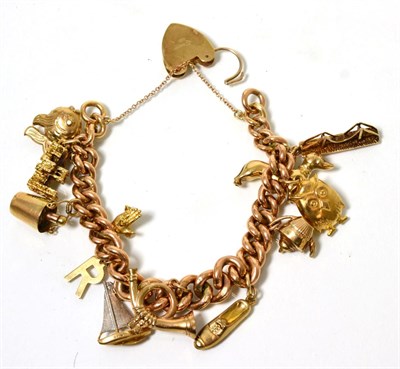 Lot 357 - A 9 carat gold curb link charm bracelet, with 9 carat gold padlock claps and twelve charms,...