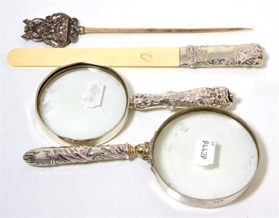 Lot 367 - A silver handled ivory page turner, Birmingham, 1900, together with two silver handled...
