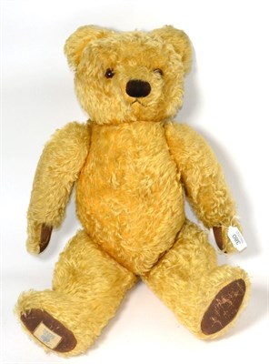 Lot 380 - Chad Valley yellow plush jointed teddy bear with stitched nose, glass eyes, suede type paw...