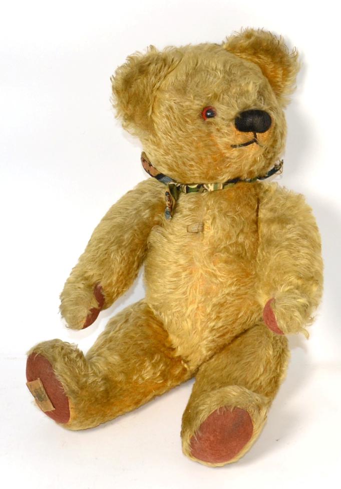 Lot 381 - Chad Valley yellow plush jointed teddy bear with glass eyes, stitched nose with felt paw pads,...