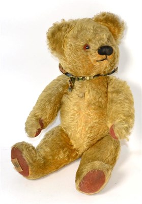 Lot 381 - Chad Valley yellow plush jointed teddy bear with glass eyes, stitched nose with felt paw pads,...