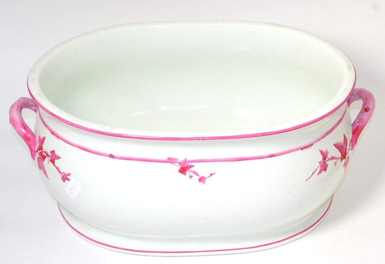 Lot 382 - A Victorian Mintons china footbath in white and pink