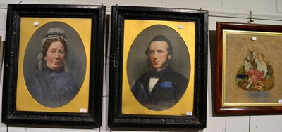 Lot 1055 - 19th century school, a pair of portraits of a man and his wife, oil on board, together with a...