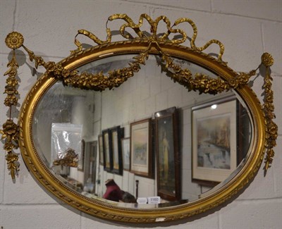 Lot 1160 - A 19th century gilt framed mirror with ribbon tied laurel surmount