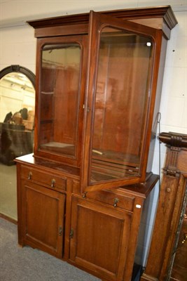 Lot 1176 - A glazed bookcase cabinet