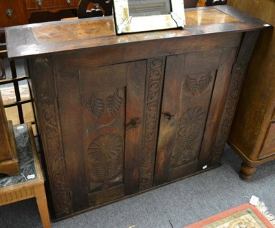 Lot 1183 - An oak cupboard