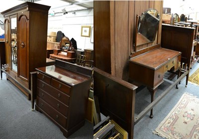 Lot 1188 - A group of bedroom furniture comprising a double bedstead, a dressing table, a four height chest of