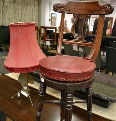 Lot 1198 - A Victorian mahogany adjustable music chair together with a lamp