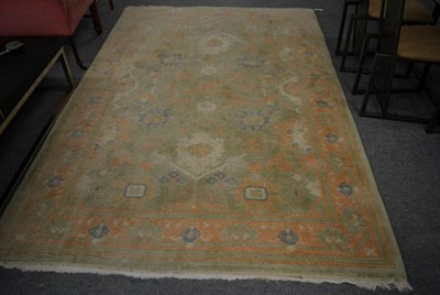 Lot 1204 - Caucasian design carpet, Nepal, the pale olive field of geometric vines enclosed by pale terracotta