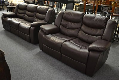 Lot 1208 - A Pellissima Italian brown leather motorised reclining three seater sofa and matching...